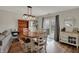 Open dining room with hardwood floors and glass doors to backyard, adjacent to a living area at 4345 Elkhorn Dr, Westfield, IN 46062