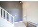 Inviting entryway with staircase, tiled floor, and stylish gray accent wall at 4345 Elkhorn Dr, Westfield, IN 46062
