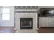 Close-up view of the fireplace with decorative accents and TV console nearby at 4345 Elkhorn Dr, Westfield, IN 46062
