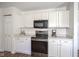 Well-lit kitchen featuring white cabinetry, stainless steel appliances and modern decor at 4345 Elkhorn Dr, Westfield, IN 46062
