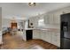 Spacious kitchen with white cabinets, granite countertops, and stainless steel appliances open to dining room at 4345 Elkhorn Dr, Westfield, IN 46062