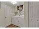 Laundry room including a side-by-side washer and dryer plus overhead cabinets at 4345 Elkhorn Dr, Westfield, IN 46062
