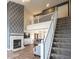 Spacious living room features a cozy fireplace and open staircase to the second floor at 4345 Elkhorn Dr, Westfield, IN 46062