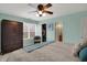 This main bedroom features a ceiling fan, big windows, and a walk-in closet at 4345 Elkhorn Dr, Westfield, IN 46062