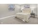 This bedroom features neutral walls, carpeted floors, and two windows for natural light at 4601 N Ball Ave, Muncie, IN 47304