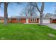 Charming brick ranch-style home with a well-maintained lawn and attached garage at 4601 N Ball Ave, Muncie, IN 47304