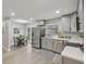 Bright and airy kitchen with stainless steel appliances and a dining area at 4601 N Ball Ave, Muncie, IN 47304