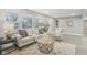 Bright living room with neutral tones, large windows, and stylish furnishings at 4601 N Ball Ave, Muncie, IN 47304
