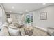 Inviting living room featuring modern decor, wood floors, and ample natural light at 4601 N Ball Ave, Muncie, IN 47304