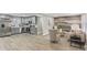 Open concept living space with updated kitchen, stainless steel appliances, and hardwood floors at 4601 N Ball Ave, Muncie, IN 47304