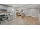Open-concept kitchen and living room with modern finishes and plenty of natural light at 4601 N Ball Ave, Muncie, IN 47304