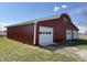 Exterior view of a red barn with white doors at 4611 E Us Highway 36, Markleville, IN 46056