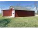 Red barn exterior featuring a white garage door at 4611 E Us Highway 36, Markleville, IN 46056
