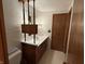 Bathroom showcasing white tile, dark wood vanity, and classic fixtures at 4611 E Us Highway 36, Markleville, IN 46056