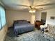 Cozy bedroom with a ceiling fan, double bed, and vintage furniture at 4611 E Us Highway 36, Markleville, IN 46056