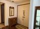 Welcoming entryway featuring classic wood accents, a decorative mirror, and ample storage at 4611 E Us Highway 36, Markleville, IN 46056