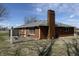 Brick home with a chimney and patio at 4611 E Us Highway 36, Markleville, IN 46056
