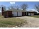 Welcoming front exterior of a brick home with a well-kept lawn and an attached two-car garage at 4611 E Us Highway 36, Markleville, IN 46056