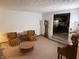 Spacious living room featuring vintage furnishings, a view of the kitchen, and a warm, inviting atmosphere at 4611 E Us Highway 36, Markleville, IN 46056