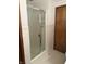 Walk-in shower with glass door and white tiling at 4611 E Us Highway 36, Markleville, IN 46056