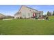 Spacious backyard with patio, fire pit, screened porch and well-maintained lawn perfect for outdoor living at 4733 Mecklenburg Dr, Plainfield, IN 46168