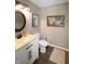Bathroom featuring an oval mirror, stylish vanity, and decorative wall art at 4733 Mecklenburg Dr, Plainfield, IN 46168