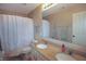 Well-lit bathroom featuring a double sink vanity with granite countertop, a toilet, and a shower with curtain at 4733 Mecklenburg Dr, Plainfield, IN 46168