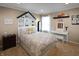 Bright and airy bedroom featuring a whimsical headboard, a vanity area, and neutral carpeting at 4733 Mecklenburg Dr, Plainfield, IN 46168
