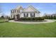 Beautiful two-story home with a well-manicured lawn and curved walkway leading to the front door at 4733 Mecklenburg Dr, Plainfield, IN 46168