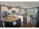 Bright kitchen featuring white cabinets, stainless steel appliances, a large island, and hardwood floors at 4733 Mecklenburg Dr, Plainfield, IN 46168