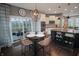 Open-concept kitchen with modern appliances, a stylish island, and a dining area at 4733 Mecklenburg Dr, Plainfield, IN 46168