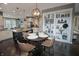 Well-designed kitchen featuring a dining area, modern lighting, and an open layout at 4733 Mecklenburg Dr, Plainfield, IN 46168