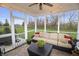 Relaxing screened porch features outdoor seating, string lights, and serene views of the surrounding greenery at 4733 Mecklenburg Dr, Plainfield, IN 46168