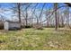 Large backyard perfect for outdoor activities and gardening, featuring a storage shed at 4906 S State Ave, Indianapolis, IN 46227