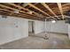 Exposed basement with white painted walls at 4906 S State Ave, Indianapolis, IN 46227
