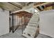 Exposed basement with stairs at 4906 S State Ave, Indianapolis, IN 46227
