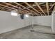 Exposed basement with white painted walls and pipes at 4906 S State Ave, Indianapolis, IN 46227