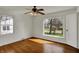Bright, empty bedroom with hardwood floors, natural light, and a spacious feel, ready for personal customization at 4906 S State Ave, Indianapolis, IN 46227