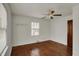 Bright bedroom featuring hardwood floors and a window at 4906 S State Ave, Indianapolis, IN 46227