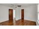 A classic bedroom with hardwood floors and painted doors at 4906 S State Ave, Indianapolis, IN 46227