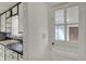Bright kitchen area with white cabinets, a light-colored countertop, and a view to an additional room in the house at 4906 S State Ave, Indianapolis, IN 46227