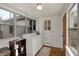 A utility room featuring a washer, dryer, and multiple windows at 4906 S State Ave, Indianapolis, IN 46227