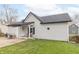 This home features a backyard patio, manicured lawn, and light gray siding at 508 Mount St, Greenfield, IN 46140