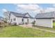 Backyard featuring a well-maintained lawn, patio furniture, detached garage, and new exterior paint at 508 Mount St, Greenfield, IN 46140