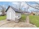 Backyard with a small garage and a stainless steel grill at 508 Mount St, Greenfield, IN 46140