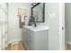 Bathroom featuring modern vanity and sleek fixtures, and a decorative mirror at 508 Mount St, Greenfield, IN 46140