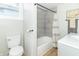 Bathroom with updated fixtures, including a toilet, vanity, and a shower-tub combo at 508 Mount St, Greenfield, IN 46140