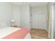 Comfortable bedroom with light gray walls, wood floor, and a sliding door closet at 508 Mount St, Greenfield, IN 46140