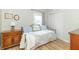 Bedroom featuring a daybed, wood floors, a window, and wooden furniture at 508 Mount St, Greenfield, IN 46140