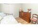 Bedroom with wood floors, a daybed, sliding door closet, and wooden dresser at 508 Mount St, Greenfield, IN 46140